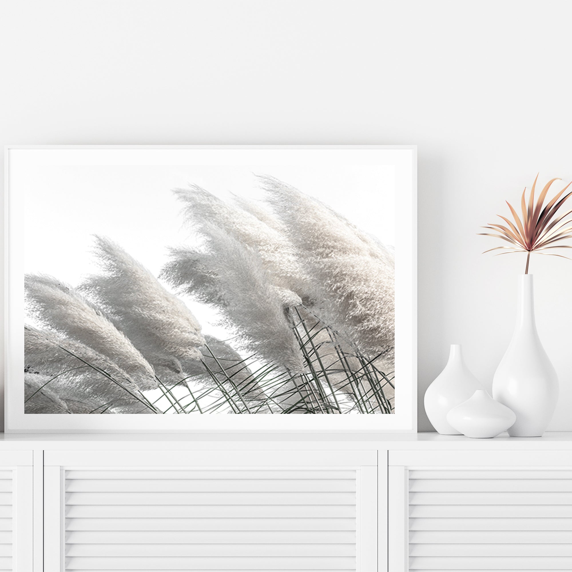 Featuring a Hamptons stretched canvas artwork of pampas grass in neutral tones available framed or unframed in timber, black or white frames.