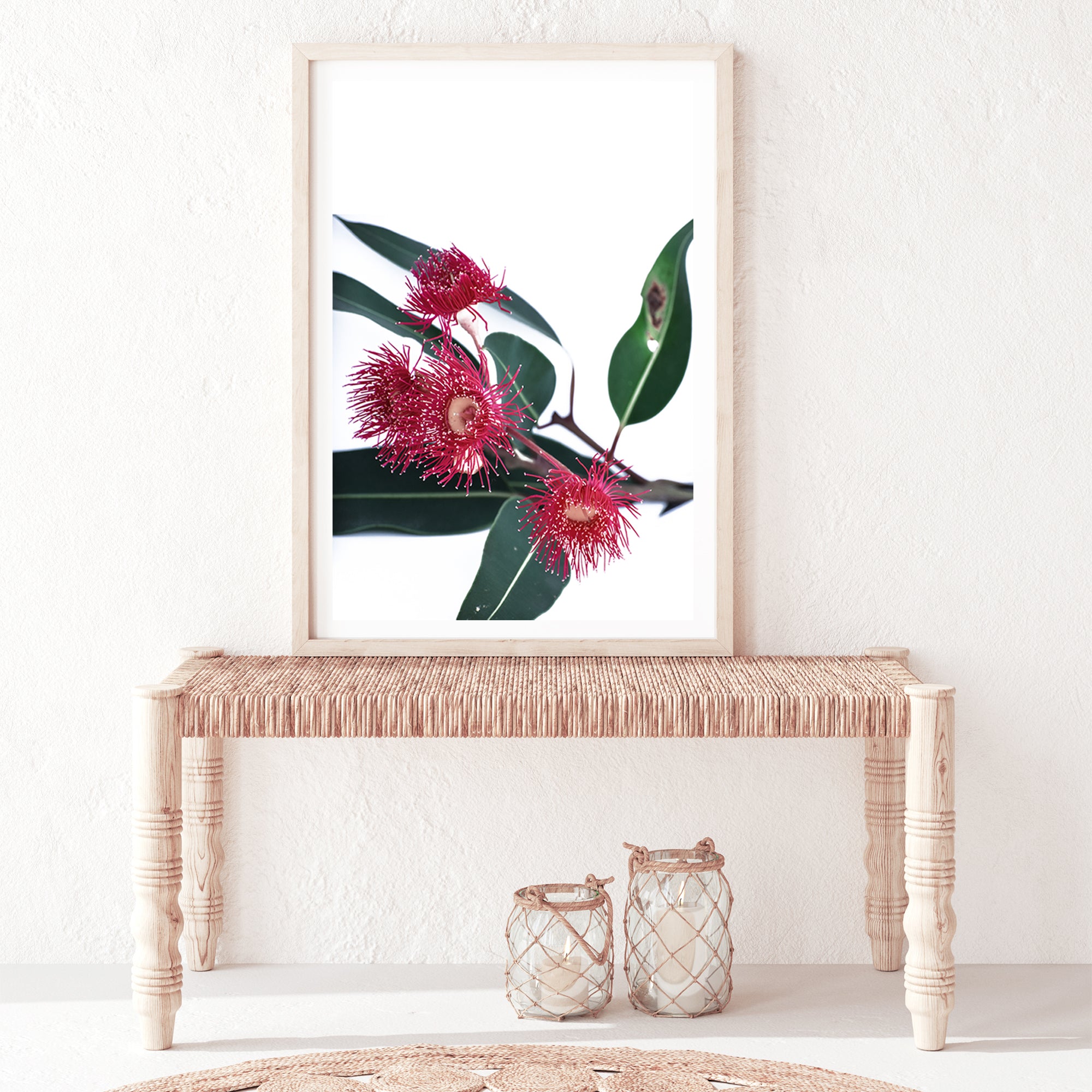 A floral photographic artwork featuring beautiful red wild flowers A and green eucalyptus leaves, available framed or unframed.