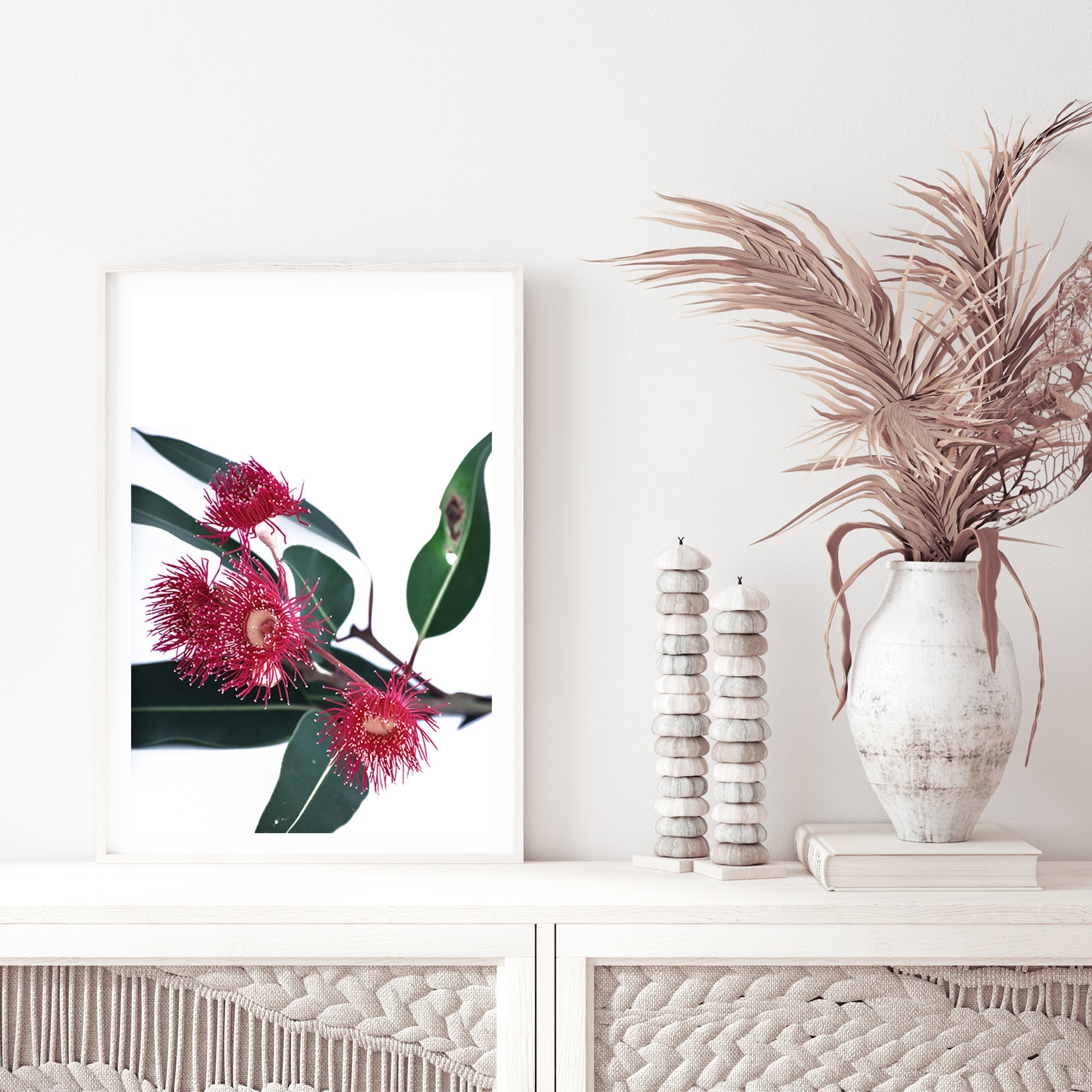 This floral art print features beautiful red wild flowers A highlighting green eucalyptus leaves, available with a timber, black or white frame.
