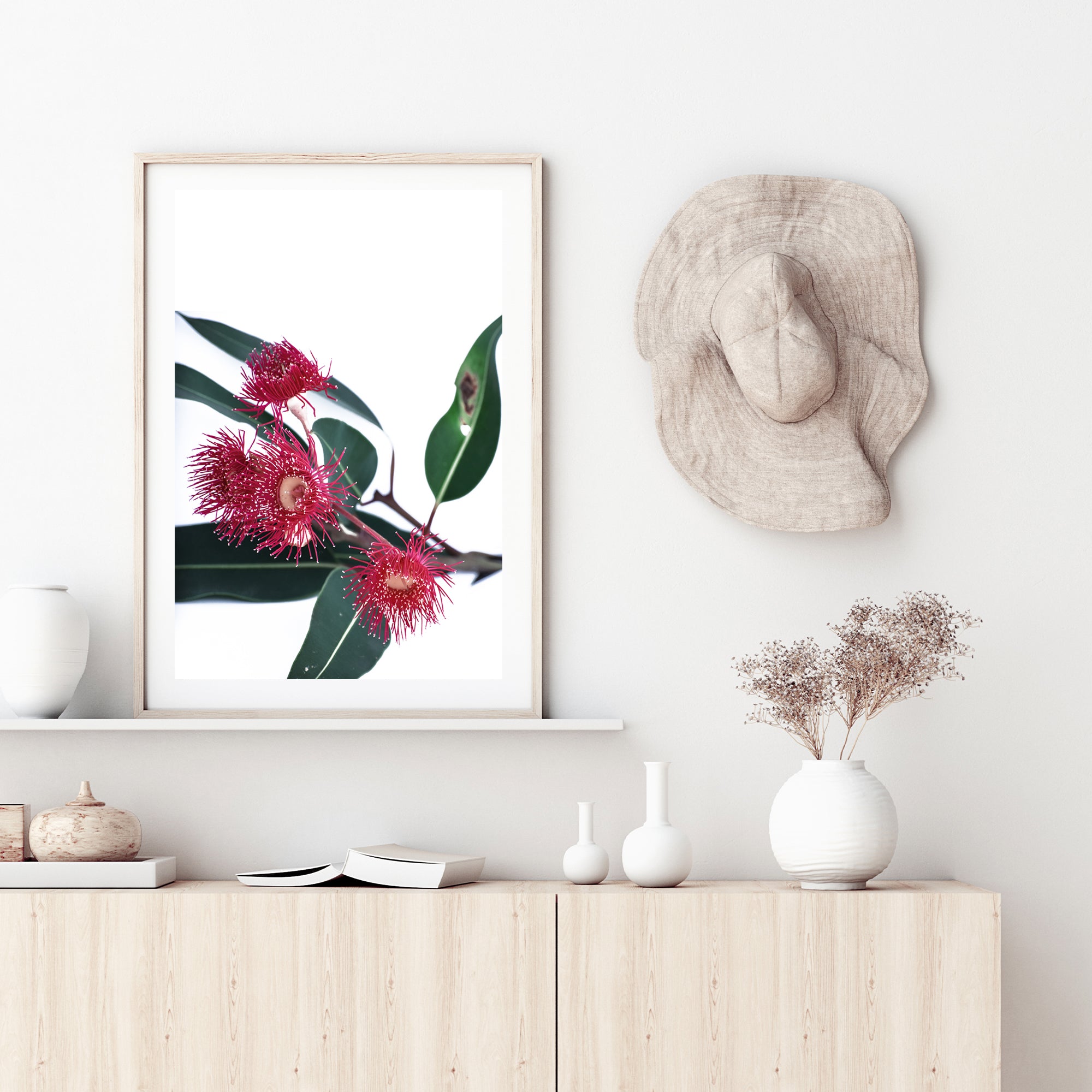 A stretched canvas floral wall art print featuring beautiful red wild flowers A with green eucalyptus leaves, available framed or unframed.