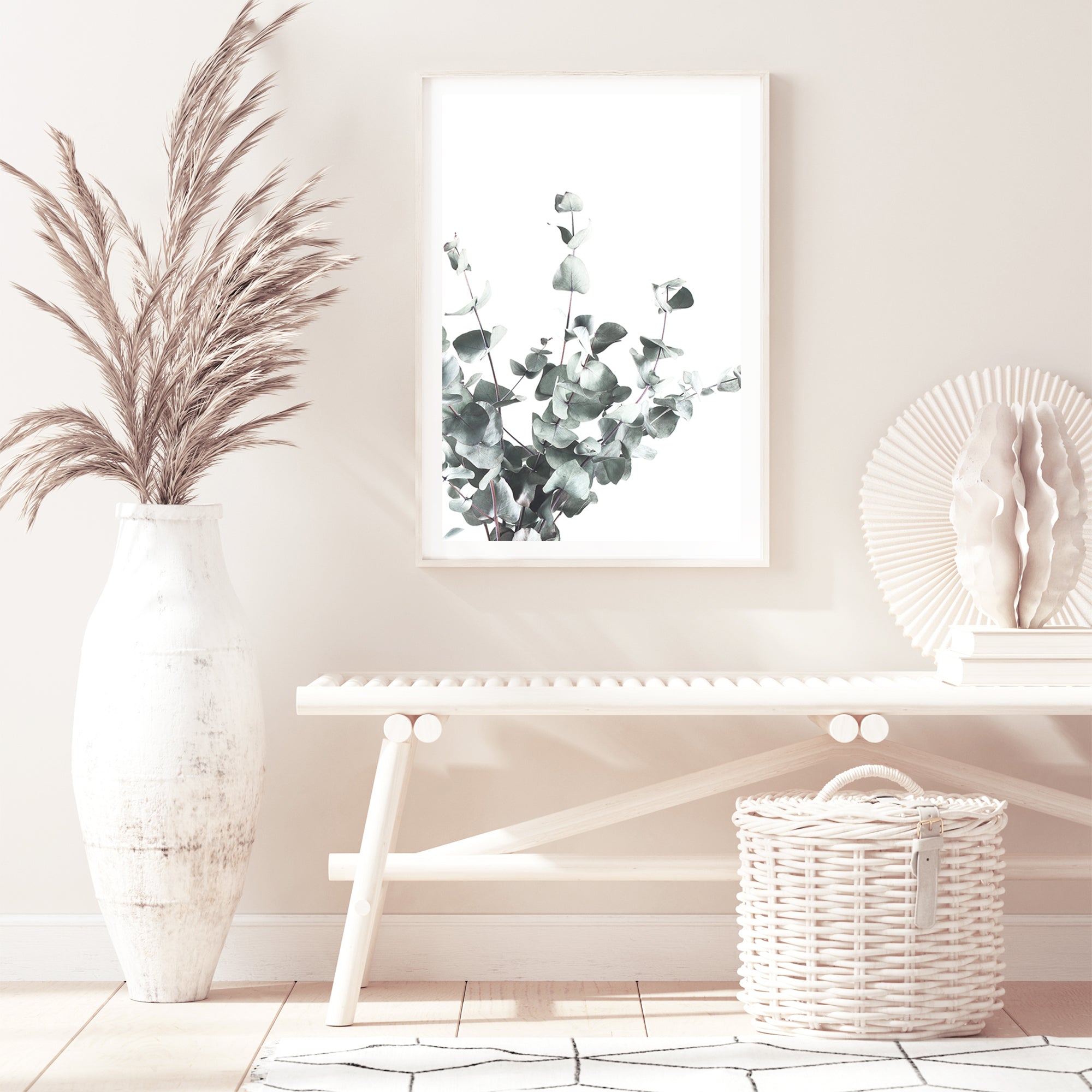 A framed or unframed canvas wall art print featuring eucalyptus leaves (A)with a light background. 