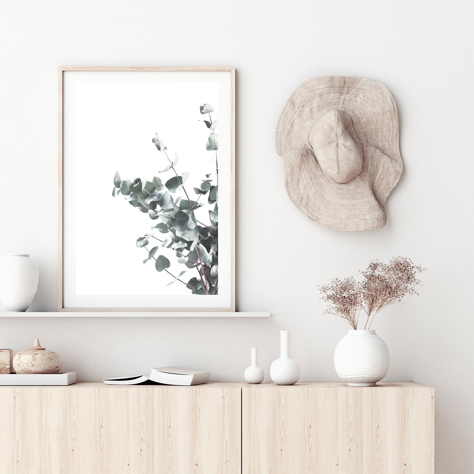 Eucalyptus leaves (B) with a light background is featured in this wall art, available in canvas and print, unframed and framed.