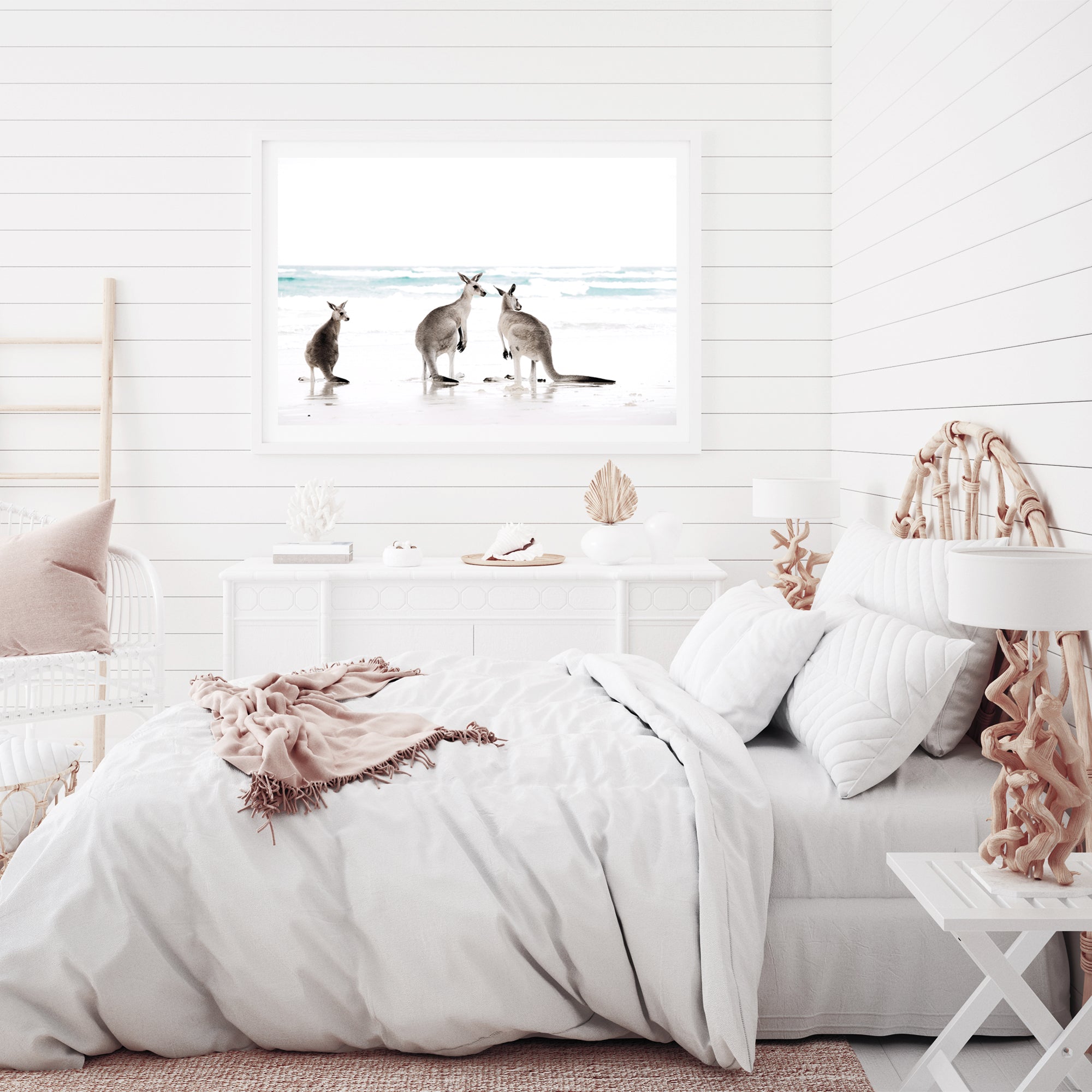 A framed or unframed coastal artwork of three kangaroos enjoying some time on the beach, available in natural timber, black or white frames.