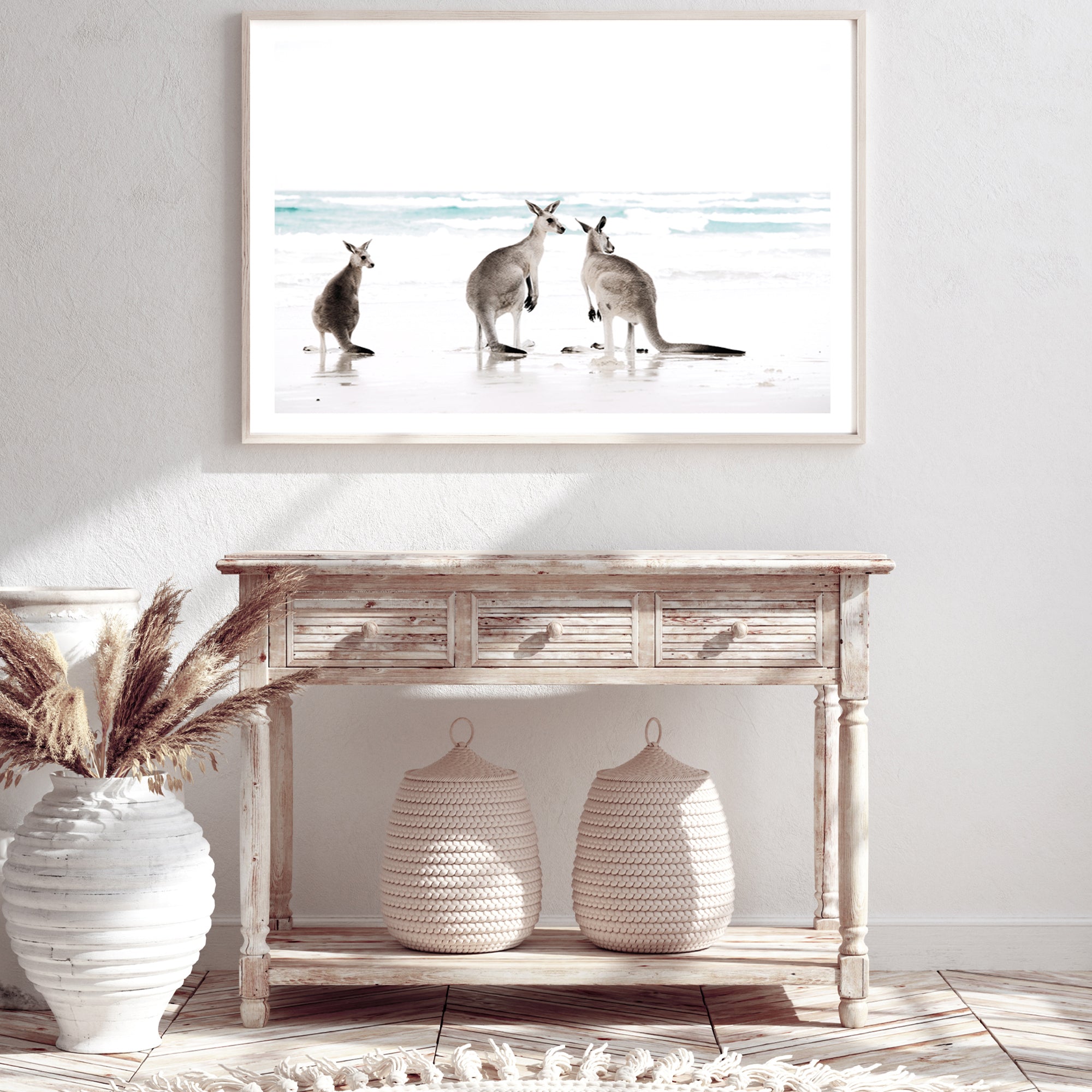 Stretched canvas wall art print of three kangaroos enjoying some time on the beach, available in natural timber, black or white frames.