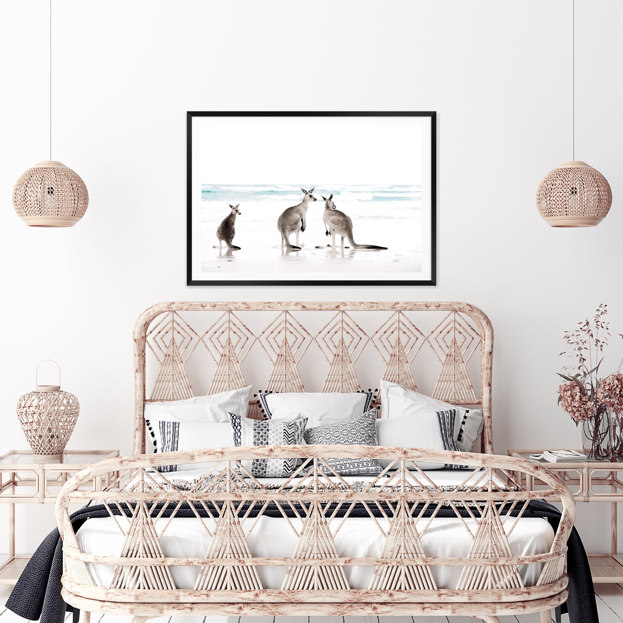 Stretched canvas artwork of three kangaroos enjoying some time on the beach, available in natural timber, black or white frames.