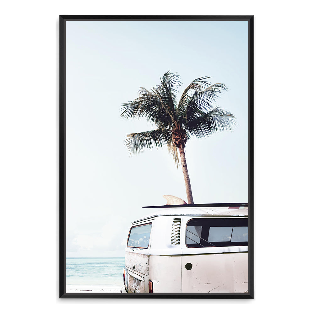 A stretched canvas print featuring a blue Kombi van at the beach with a blue sky and palm trees, available unframed or framed.