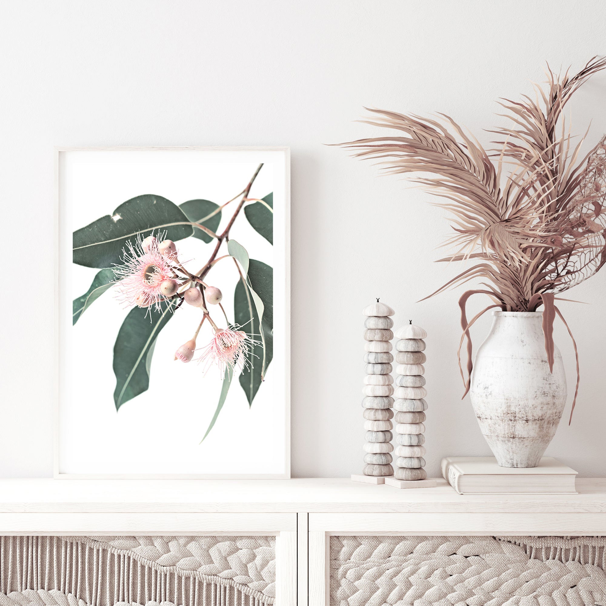A framed or unframed wall art print of pink eucalyptus wild flowers and green leaves with a neutral background on canvas or photo print  of a native gum eucalyptus flower a wall art.