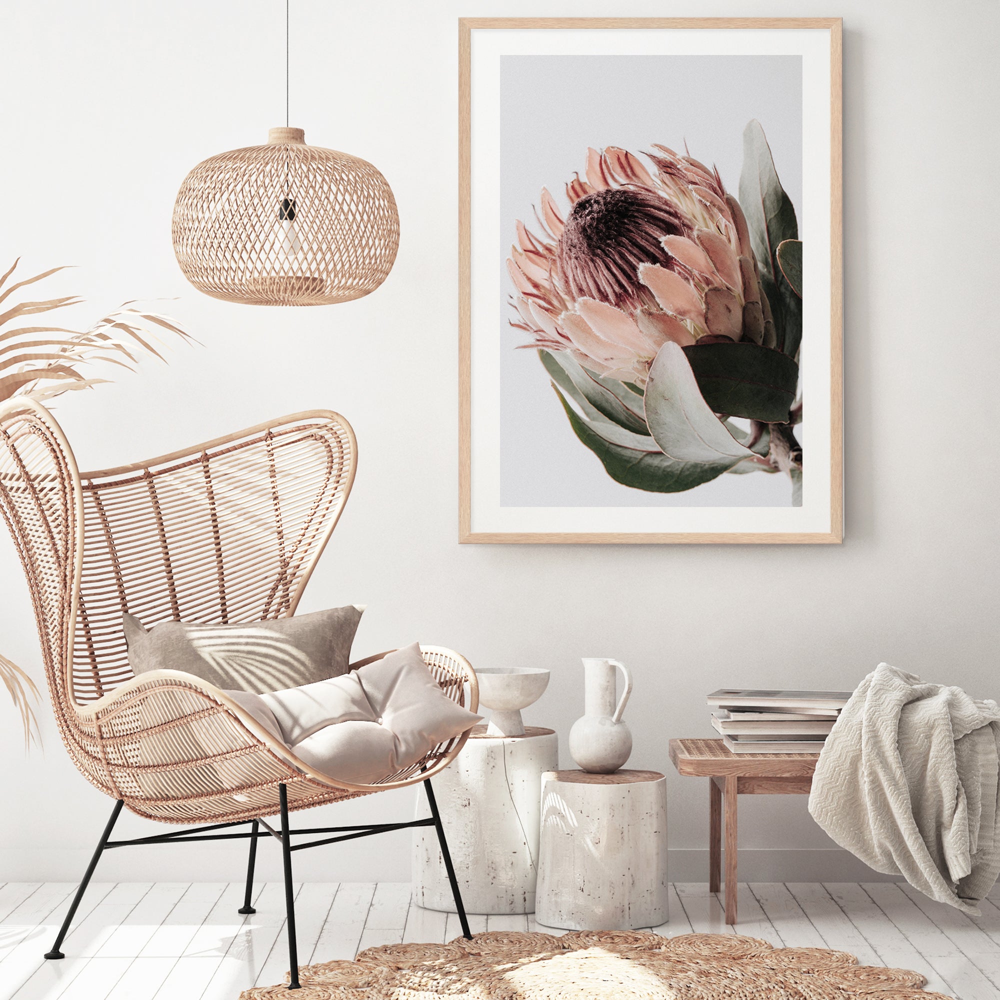 A beautiful peach protea flower with green leaves in muted tones available as a framed or unframed artwork print.