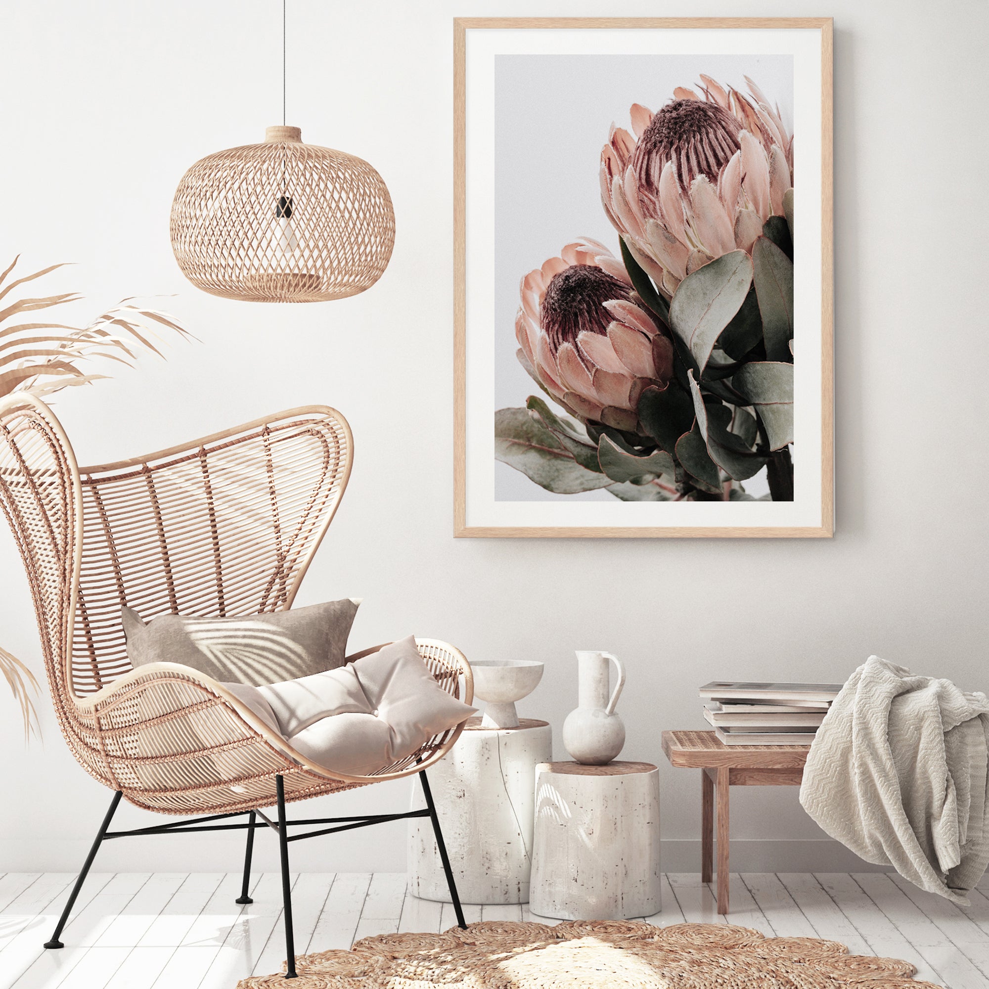 An artwork print of two beautiful peach protea flowers with green leaves in muted tones available unframed or framed. 