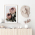Two beautiful peach protea flowers with green leaves in muted tones available as a framed or unframed artwork print.