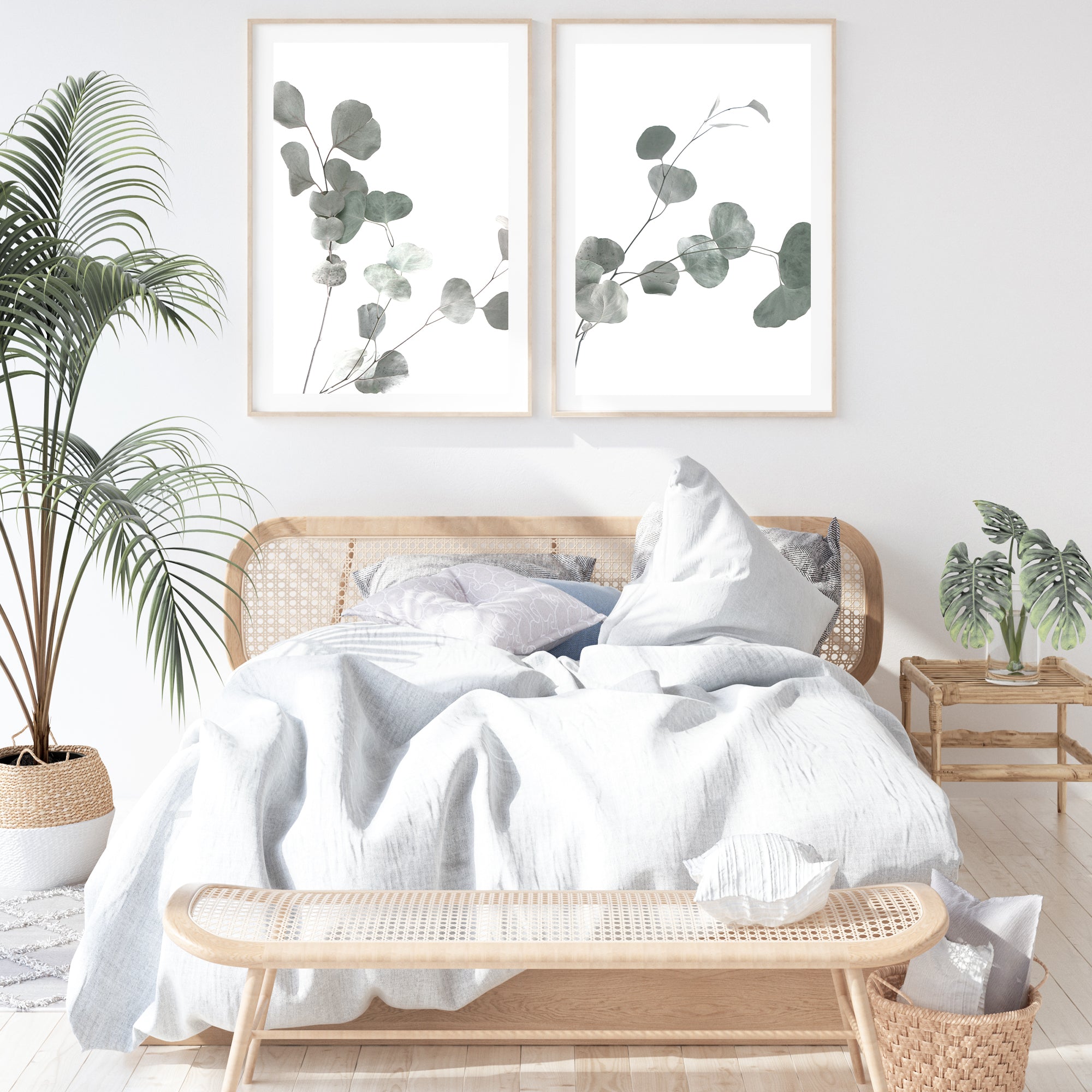 An artwork set of 2 wall art prints featuring eucalyptus leaves with a neutral background, available as an unframed poster print. 