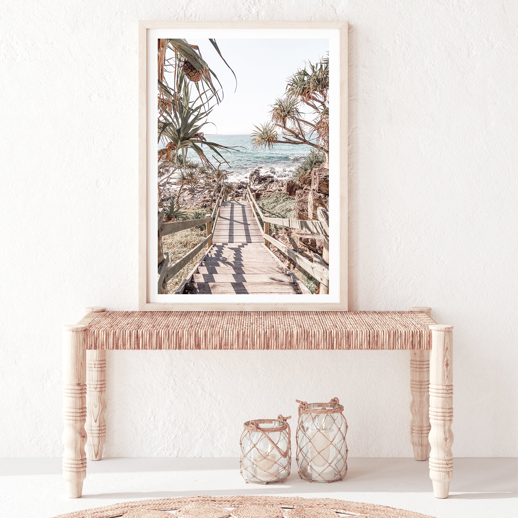 Enjoy the view of the beach and sea in this coastal artwork of stairs with trees leading onto a Queensland beach.