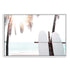 A coastal wall art of two white surfboards on a beach under the palm trees with a tropical sunset view.