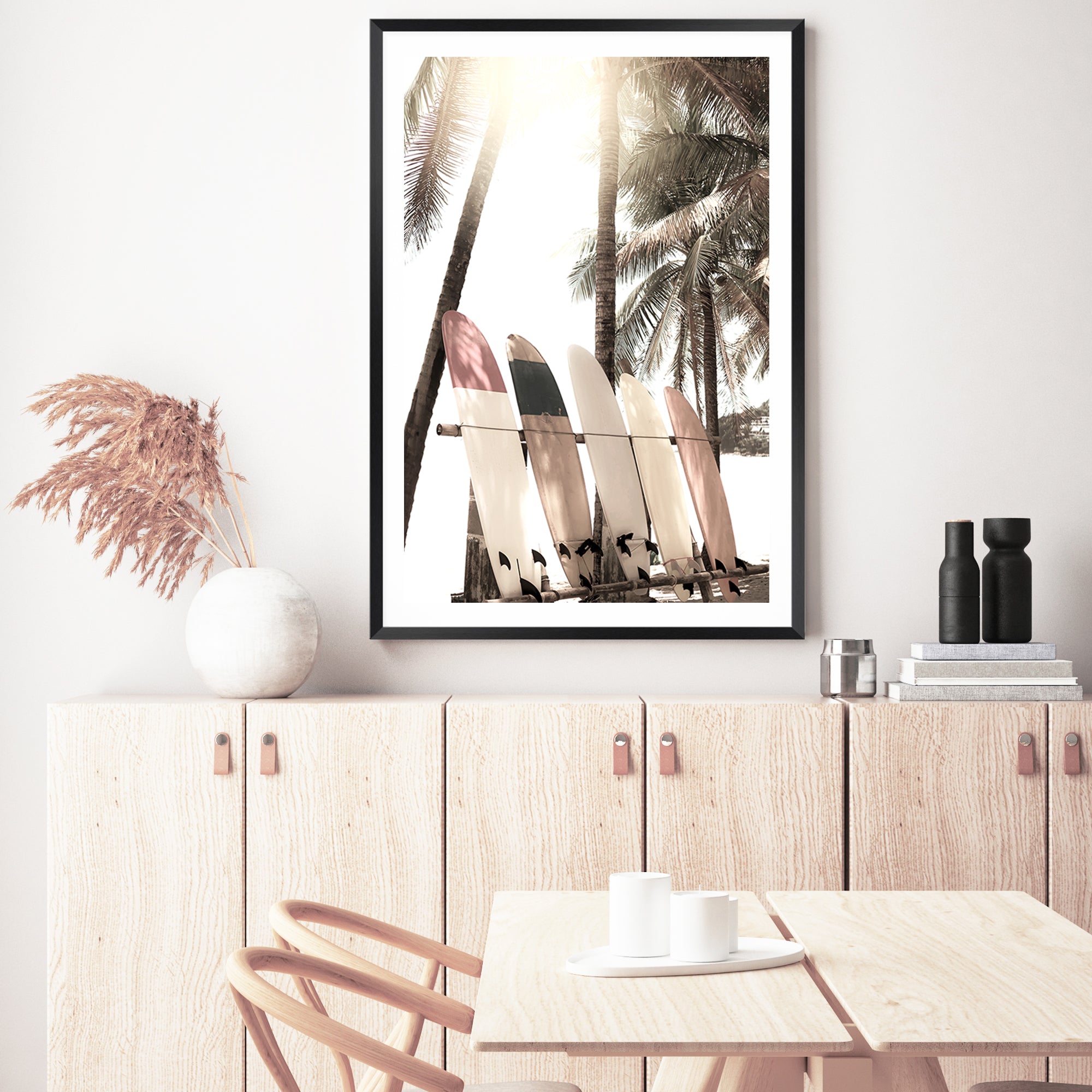A photographic artwork of four white surf boards under the palm trees with a tropical sunset available in canvas and art print.