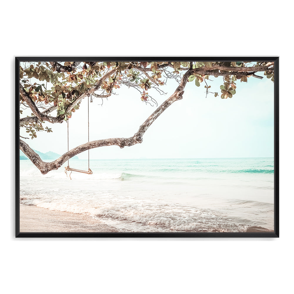 A photo wall art print of a beachside swing, available in a framed or unframed print and canvas.